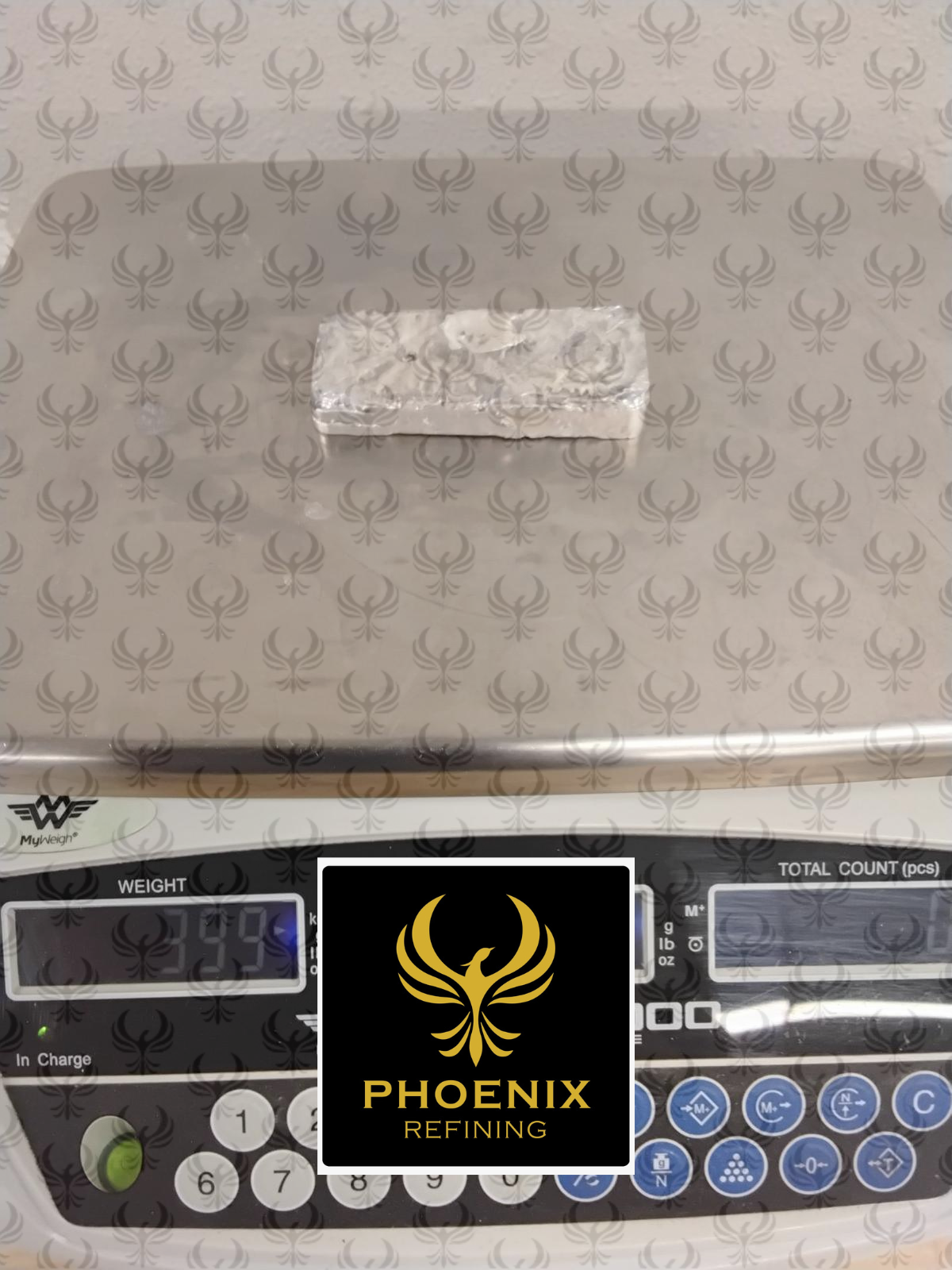 Silver doré bar on a scale