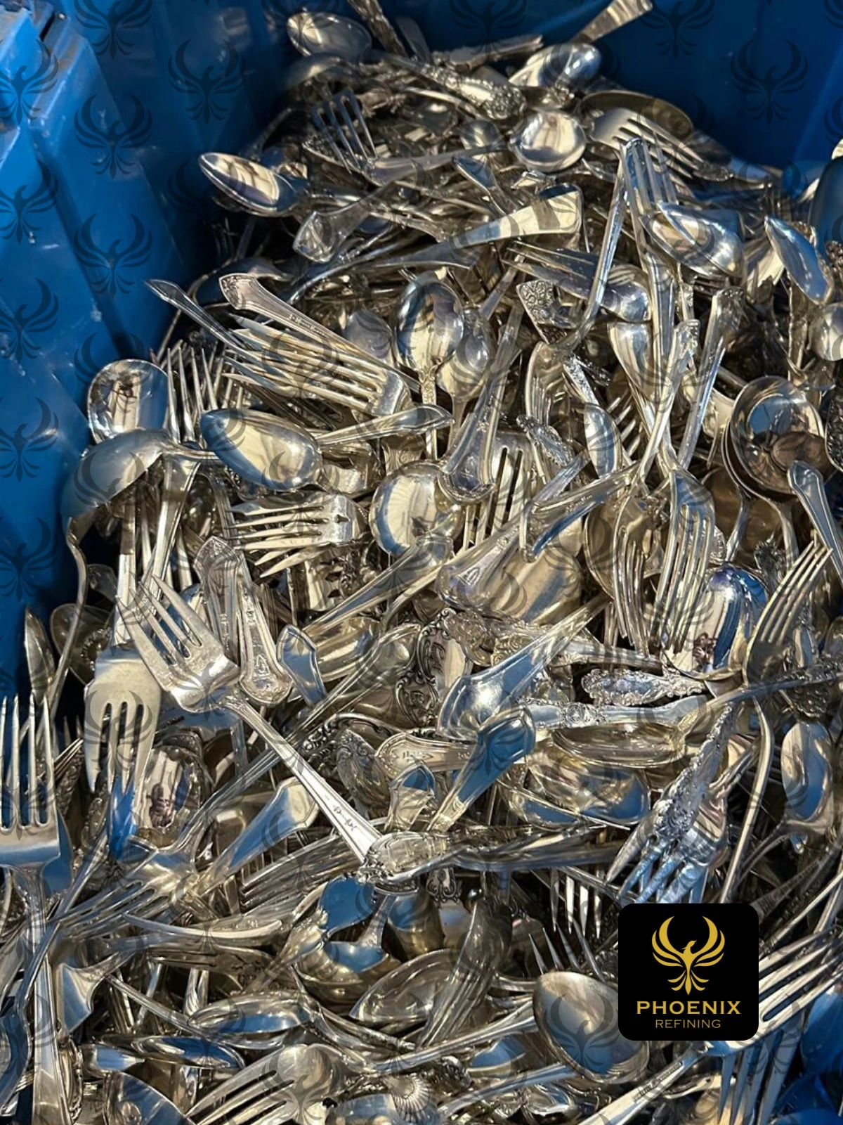 Container of sterling silver flatware